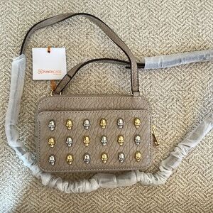 Tan pebbled vegan leather Braxton x-body.